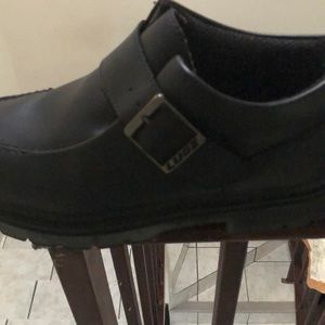 Black leather lugz strap ankle boots